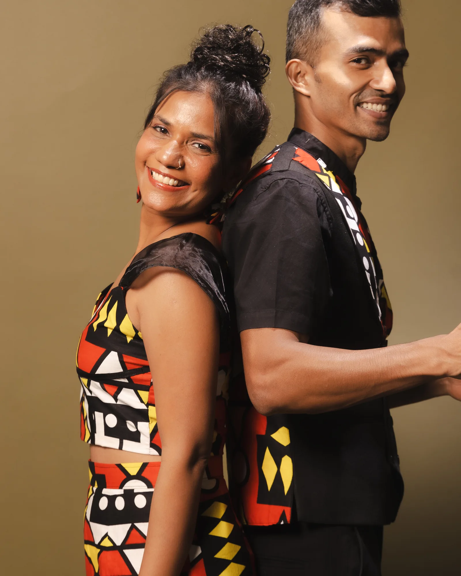 Namrata and Elvis back to back, laughing