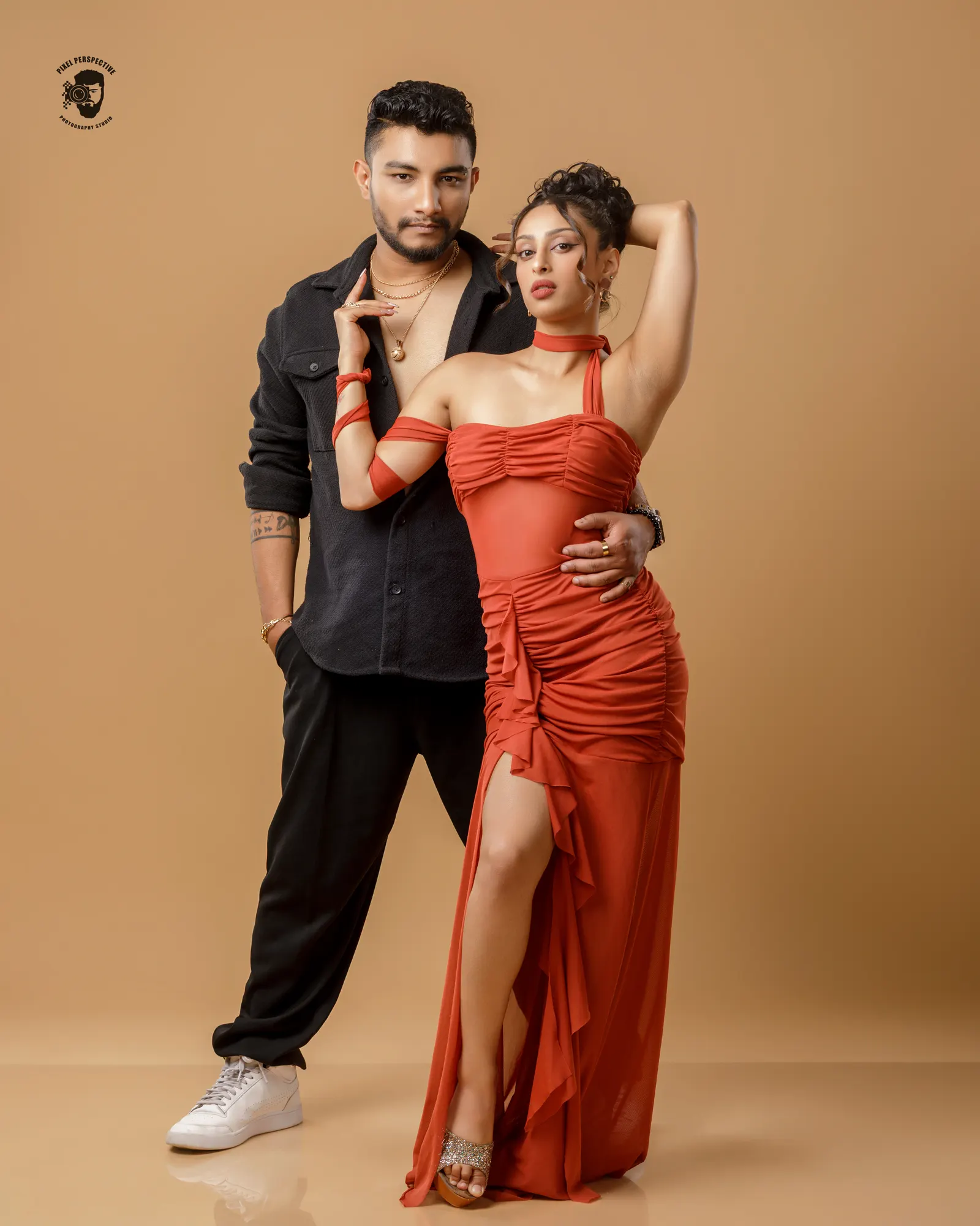 Danny and Yoshitha of Team ConRi posed close in the studio, her dress mid-flare