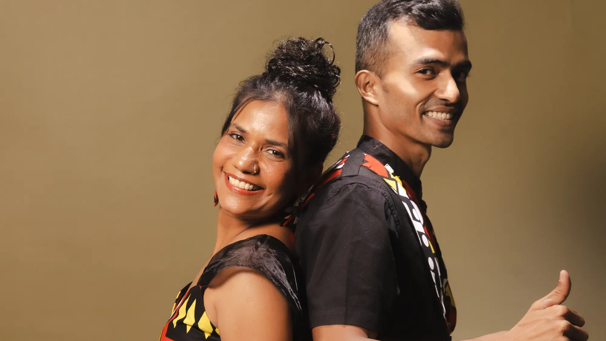 Namrata and Elvis of Rare Grooves back to back — her grin, his thumbs-up — the duo building this edition